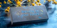 Engraved metal plate with welcome to your future message on blue textured background with yellow wildflowers creating atmospheric composition.