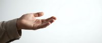 Open male hand reaching out in gesture of giving, receiving or presenting against clean white background for business and communication concepts.