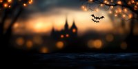 Spooky Halloween scene with haunted castle silhouette against orange sunset sky, flying bats and glowing bokeh lights creating mysterious atmosphere.