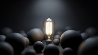 Glowing vintage filament bulb surrounded by dark matte spheres on black background, representing innovation, creativity, and unique ideas for business concepts.