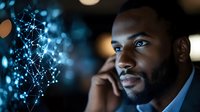 African American businessman using smartphone with digital network connections and glowing bokeh lights in modern office environment at night.