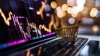 Shopping cart on laptop keyboard with stock market chart and bokeh lights in background, representing online trading and e-commerce financial markets.
