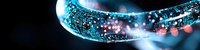 Glowing curved line with sparkling blue and pink particles against dark background creates futuristic technology concept for digital transformation designs.