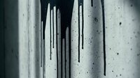 Black paint dripping down a textured concrete wall, creating dramatic streaks and splatter patterns in monochrome tones for grunge backgrounds.