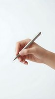 Hand holding silver pen in writing position isolated on white background for business and education design projects.