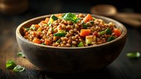 Nutritious lentil salad with colorful vegetables and fresh herbs in wooden bowl. Healthy plant-based meal rich in protein and fiber for balanced diet.