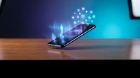 Modern smartphone on wooden desk displaying holographic network connections and digital particles in futuristic office environment for technology concepts.