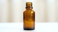 Amber glass bottle with screw cap on white surface, suitable for essential oils, pharmaceuticals, cosmetics, and laboratory storage applications.