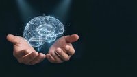 Human hands holding glowing digital brain hologram representing artificial intelligence, machine learning, and neuroscience concepts for technology presentations.