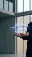 Businessman hands holding holographic AI governance framework and policy simulation technology in modern office environment for corporate innovation.