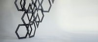 Abstract geometric hexagonal shapes falling or floating in minimalist white space creating modern architectural design element for contemporary branding projects.