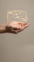 Hand holding transparent holographic circuit board with glowing golden tech interface and digital connections for innovation and technology concepts.