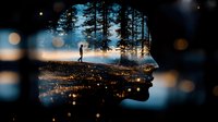 Double exposure silhouette combining human profile with misty forest landscape and lone figure standing on cliff edge, mystical bokeh light effects at dusk.