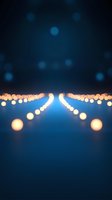 Abstract blurred bokeh lights creating dreamy atmosphere with warm golden orbs against deep blue background for romantic events and celebrations.