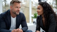 Diverse business colleagues in professional attire having engaging conversation during office meeting, showing positive workplace interaction and teamwork.