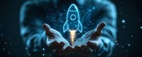 Glowing rocket hologram floating above business person hands against dark background with sparkles and particles, symbolizing startup launch and innovation.