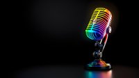 Vintage studio microphone illuminated by vibrant rainbow colored lights against dark background, creating dramatic contrast for music and entertainment concepts.