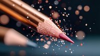 Sharp pink pencil tip with magical sparkles and bokeh effects on dark background, creative macro photography highlighting artistic inspiration and creativity.