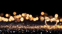 Glowing heart shape made of golden lights on dark background with bokeh and glitter, romantic atmosphere for Valentine's day and special occasions.