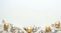 Metallic and pearl ornaments arranged on white textured surface with gold and silver baubles for holiday decoration and festive design projects.