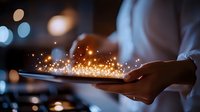 Magical glowing sparkles floating above smartphone in hands at night, blurred city lights background creates mystical atmosphere. Digital transformation concept.