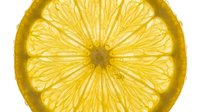 Sliced lemon with translucent flesh and visible segments isolated on white background, suitable for food, beverage, and culinary design projects.