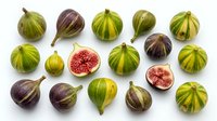 Fresh figs arranged on white background, whole and halved fruits showing pink flesh and seeds, suitable for food photography, culinary content, and healthy eating designs.