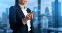 Professional businesswoman touching holographic digital interface with financial data charts and graphs in modern office environment for technology presentations.