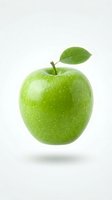 Fresh green apple with leaf isolated on white background, perfect for food and nutrition design projects.