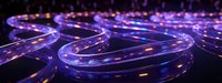 Glowing curved glass tubes with purple and blue neon illumination creating futuristic technological pattern in dark space. Abstract modern background.