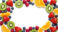 Colorful fresh fruit frame with strawberries, blueberries, raspberries, kiwi and orange slices arranged on white background for healthy eating concepts.