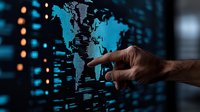Male hand pointing at glowing blue world map on dark digital display with data visualization elements. Global business analytics and international technology concept.