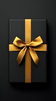 Elegant black gift box with luxurious golden ribbon and bow for special occasions and celebrations.