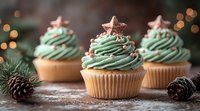 Festive mint green swirled cupcakes decorated with pink star toppers and dusted with sugar powder, arranged with pine cones against dark background with bokeh lights.