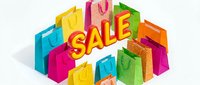 Colorful shopping bags arranged around a bold sale sign on white background, perfect for retail promotions, discount events, and seasonal shopping campaigns.