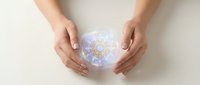 Female hands gently protecting glowing digital globe with network connections, symbolizing global communication, technology protection and connectivity.