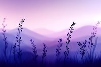 Dreamy purple mountain landscape with silhouettes of wild grass and plants against misty hills at dawn, creating serene atmospheric nature background.