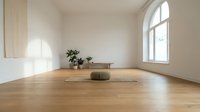 Minimalist meditation room with wooden floors, white walls, large window and green cushion for yoga practice, mindfulness and relaxation in modern home interior.