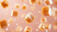 Floating golden caramel cubes with tiny bubbles on pink background, sweet candy pieces in zero gravity for food industry and confectionery advertising.