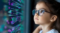 Young girl with glasses studying colorful programming code on computer screen, focused on learning software development and technology education.