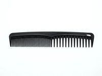 Black hair comb with fine and wide teeth isolated on white background, ready for salon, grooming, and beauty product design use.