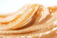 Abstract golden waves with glowing sparkles and soft curves create luxurious background for cosmetic, beauty, or festive designs. Elegant motion effect in warm tones.