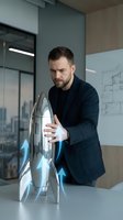 Caucasian businessman in dark suit presenting futuristic silver rocket model with blue energy effects in modern office conference room for startup pitch.