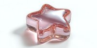 Pink glass star-shaped bowl or decorative container with translucent finish isolated on white background for modern home decor and design projects.
