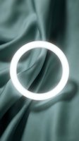 Glowing white neon circle ring on draped teal fabric with soft folds, modern minimalist design for contemporary art, advertising, and digital projects.