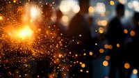 Magical glowing orange sparks and bokeh lights against dark background create atmospheric festive mood. Blurred golden particles float in space.