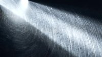 Brushed metal surface with circular grain pattern and dramatic lighting creating industrial metallic texture background for modern design projects.