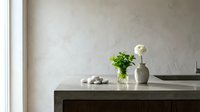 Minimalist kitchen counter with fresh herbs in vase and white flower, clean modern interior design for home decor and culinary lifestyle concepts.