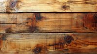 Rustic wooden planks with natural grain pattern and knots showing weathered texture in warm brown tones, suitable for background and design projects.