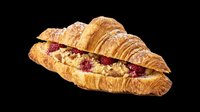 Flaky croissant filled with raspberries and cream, dusted with powdered sugar, isolated on transparent background. Great for bakery menus, stickers, t-shirt design, and print on demand.
